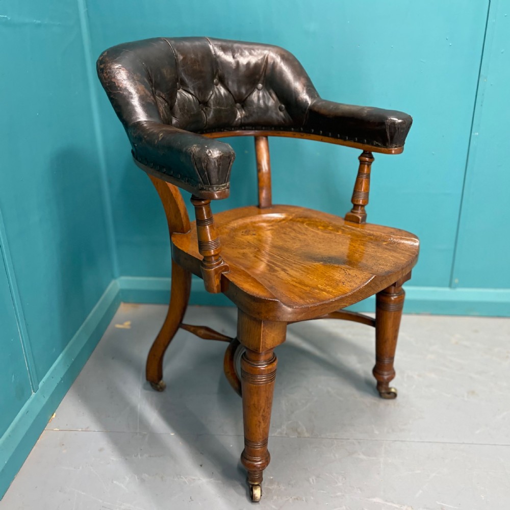 Victorian leather back desk chair with crinoline stretcher View III