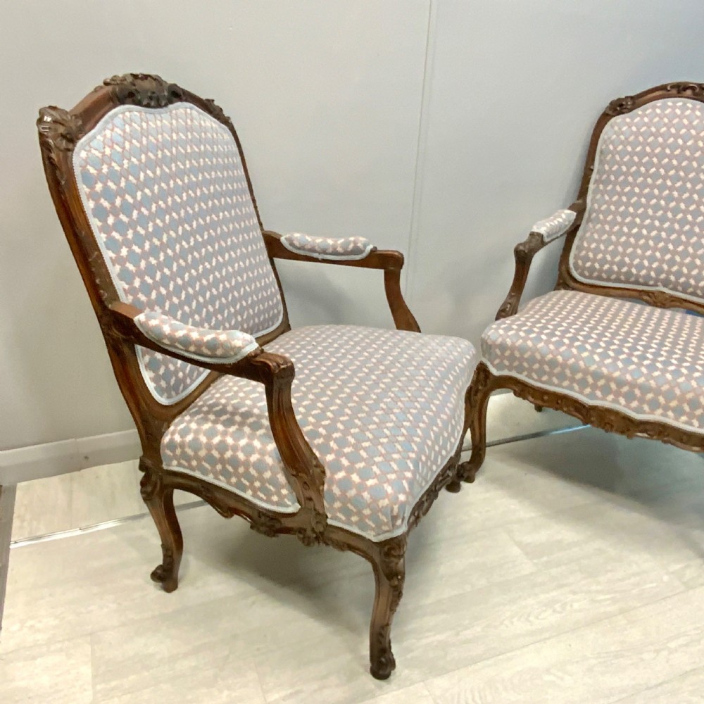 Very near pair of French walnut open armchairs View II