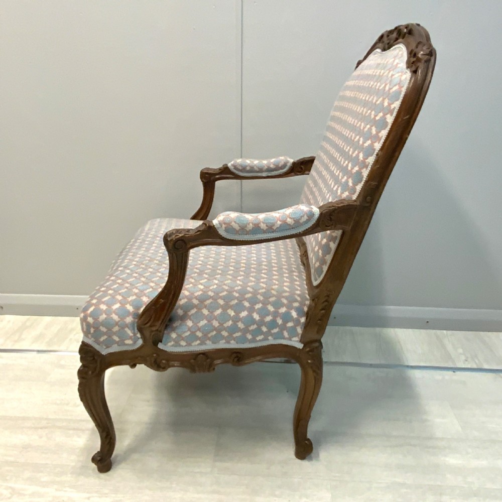 Very near pair of French walnut open armchairs View III
