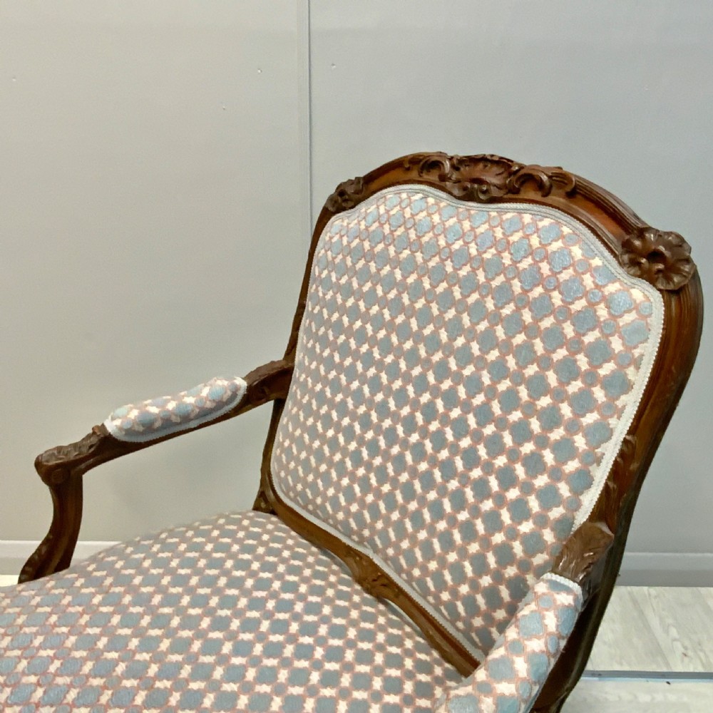 Very near pair of French walnut open armchairs View V