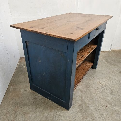 fig 2. A blue painted pine shop counter featuring three recessed front panels and an unpainted natural timber top.