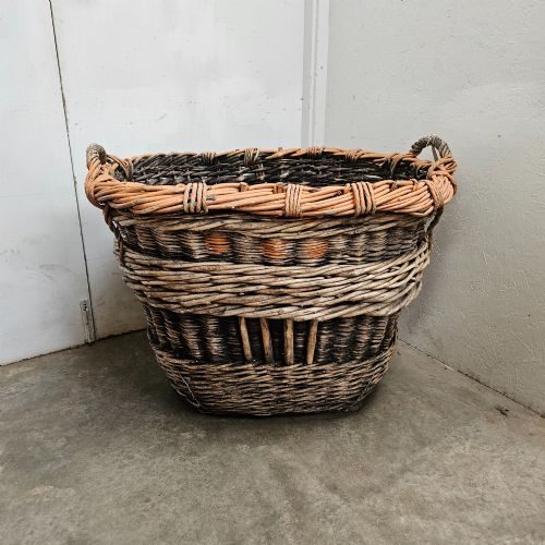 fig 1. A large, rustic hand-woven willow French champagne harvest basket with woven rim detailing and integrated side handles.