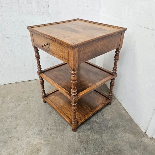 fig 1. A French walnut etagere featuring three tiers, turned spindle supports, and a single top drawer with a brass handle.