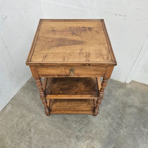 fig 2. A French walnut etagere featuring three tiers, turned spindle supports, and a single top drawer with a brass handle.