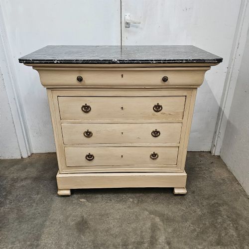 fig 2. An off-white painted Louis Philippe chest of drawers with a dark marble top and brass ring handles.