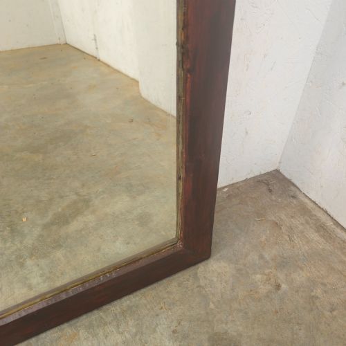 fig 1. A large 19th-century rectangular full-length mirror with a dark-stained pine frame.