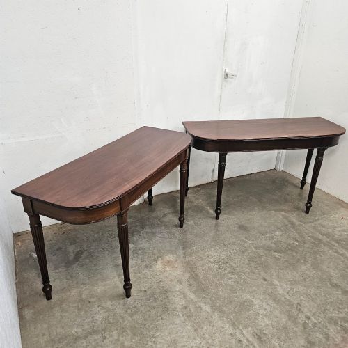 fig 2. A pair of English mahogany console tables featuring D-shaped tops, subtle reeded aprons, and slender fluted tapered legs.