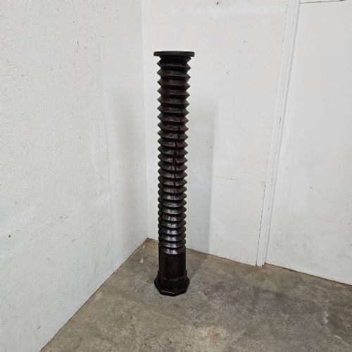 fig 2. A tall hand-carved dark walnut wooden wine press screw with a continuous spiral thread.