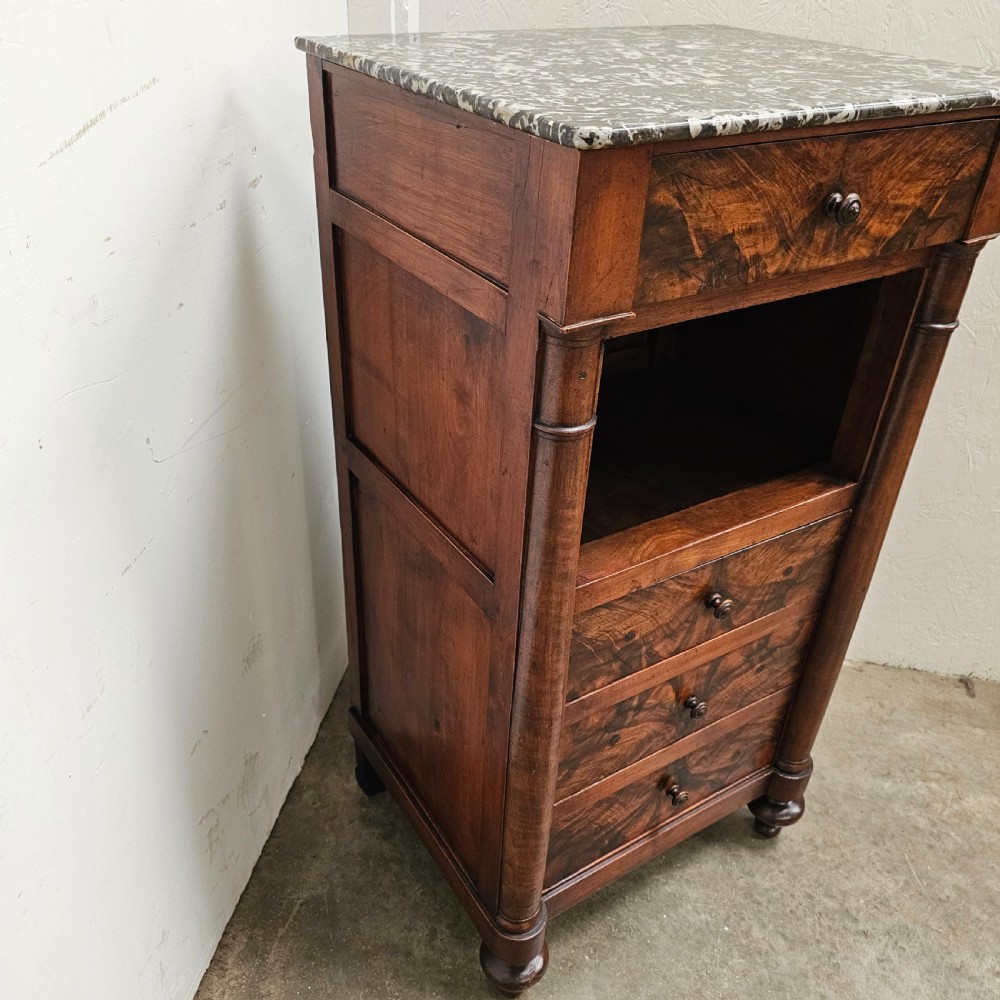 A French 19th-century figured walnut nightstand with a grey variegated marble top, featuring an open shelf above three lower drawers. View IV