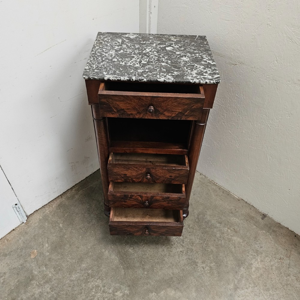 A French 19th-century figured walnut nightstand with a grey variegated marble top, featuring an open shelf above three lower drawers. View V