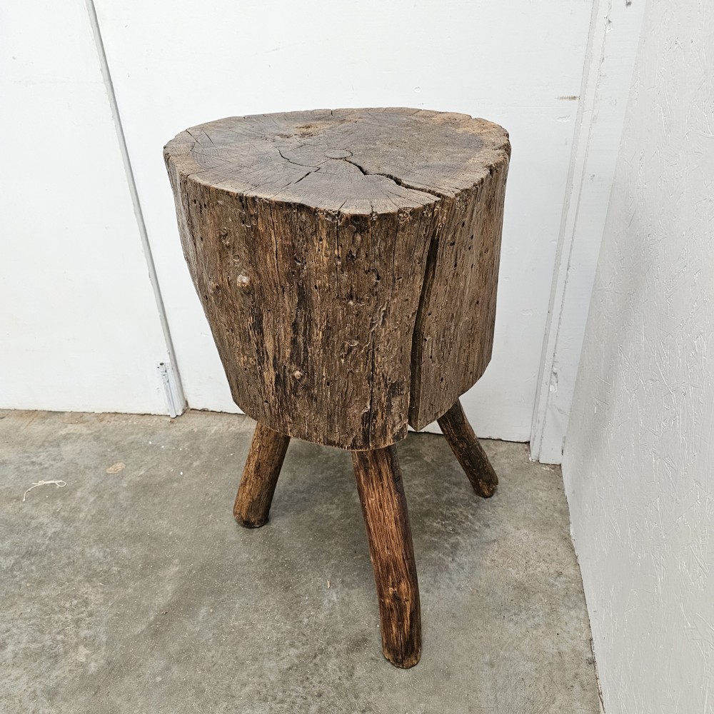 A rustic 19th-century French oak game block featuring a thick solid timber section supported by three splayed wooden legs. View II