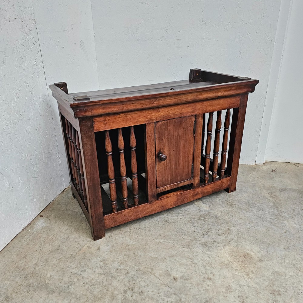 A 19th-century French provincial walnut panetiere with turned spindle sides, a central solid door, and a rich dark finish. View II
