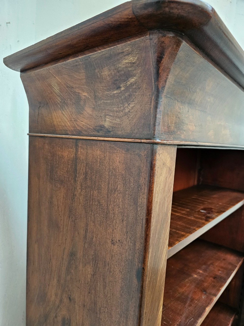 A 19th-century French open bookcase crafted from warm brown walnut wood featuring five adjustable shelves and a classic plinth base. View VI