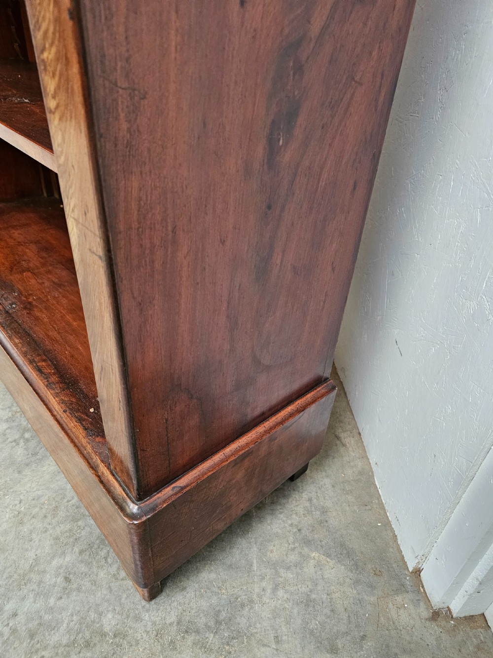 A 19th-century French open bookcase crafted from warm brown walnut wood featuring five adjustable shelves and a classic plinth base. View VII