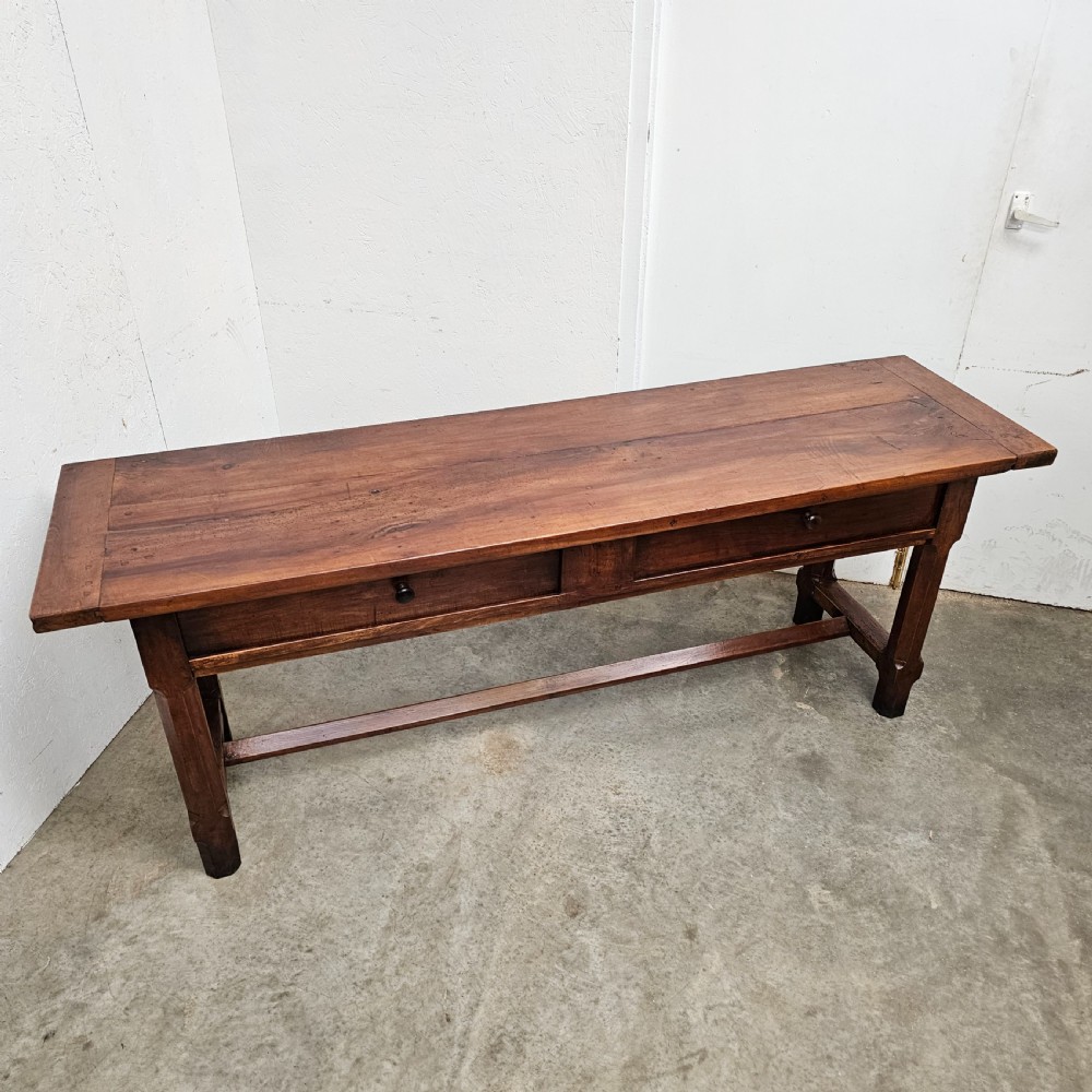 A long 19th-century dark brown wooden bread prep table featuring two drawers with round knobs and a low horizontal stretcher. View III