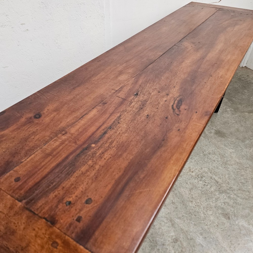 A long 19th-century dark brown wooden bread prep table featuring two drawers with round knobs and a low horizontal stretcher. View IV