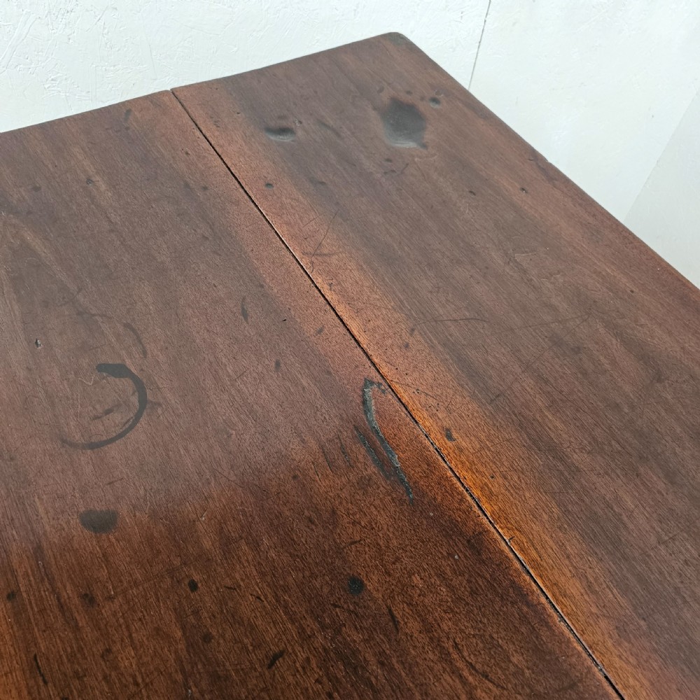 An antique French dark walnut bread prep table featuring a two-board top, side pedestal storage compartment, and lower stretcher base. View VIII