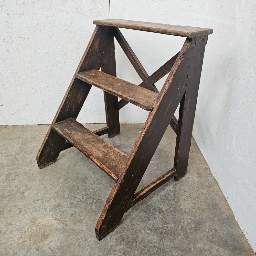 A three-tier dark pine wooden step stool featuring an A-frame structure with a cross-brace on the reverse. View III