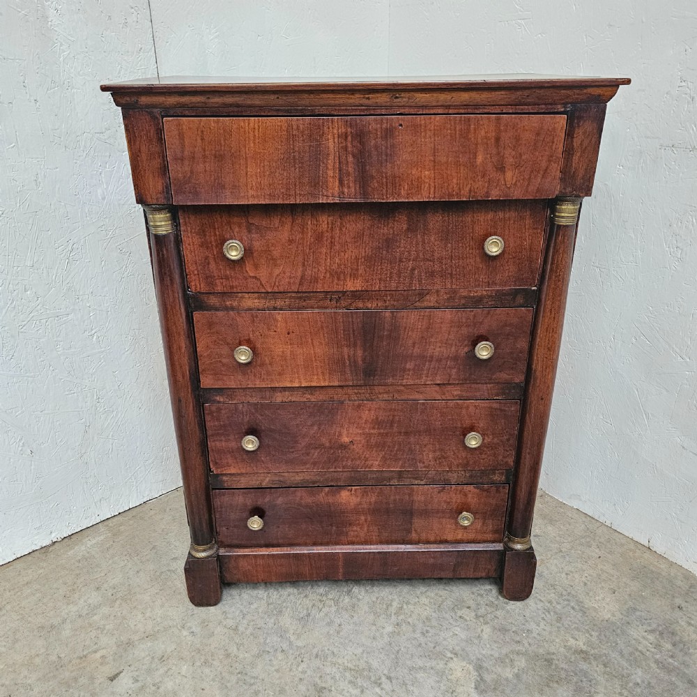 A five-drawer French Empire style mahogany chest featuring brass knobs and flanking pilaster columns. View II