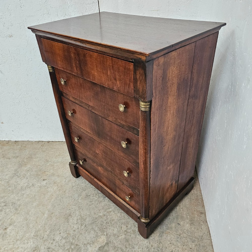 A five-drawer French Empire style mahogany chest featuring brass knobs and flanking pilaster columns. View V