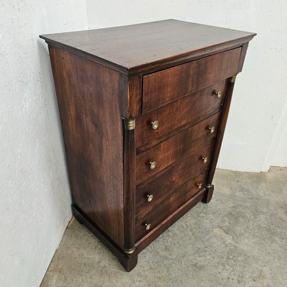 A five-drawer French Empire style mahogany chest featuring brass knobs and flanking pilaster columns. View VI