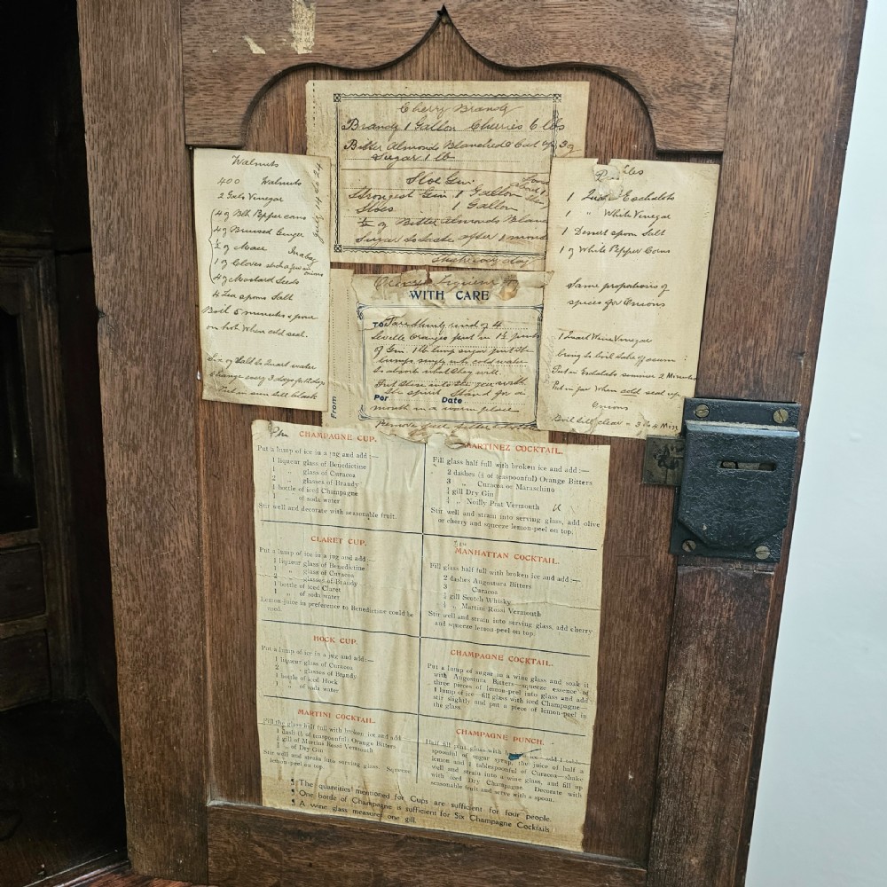 An eighteenth-century dark oak Welsh deuddarn press cupboard featuring three ogee arched upper doors above drawers and fielded lower panel doors. View VIII
