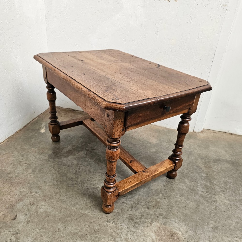 A small antique French walnut end table featuring turned wooden legs, a low stretcher base, and a single drawer with a dark turned knob. View III