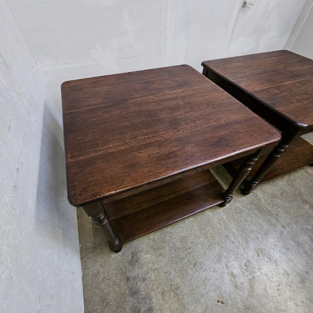A matching pair of dark French oak square low display tables featuring turned legs and a solid lower tier shelf. View III