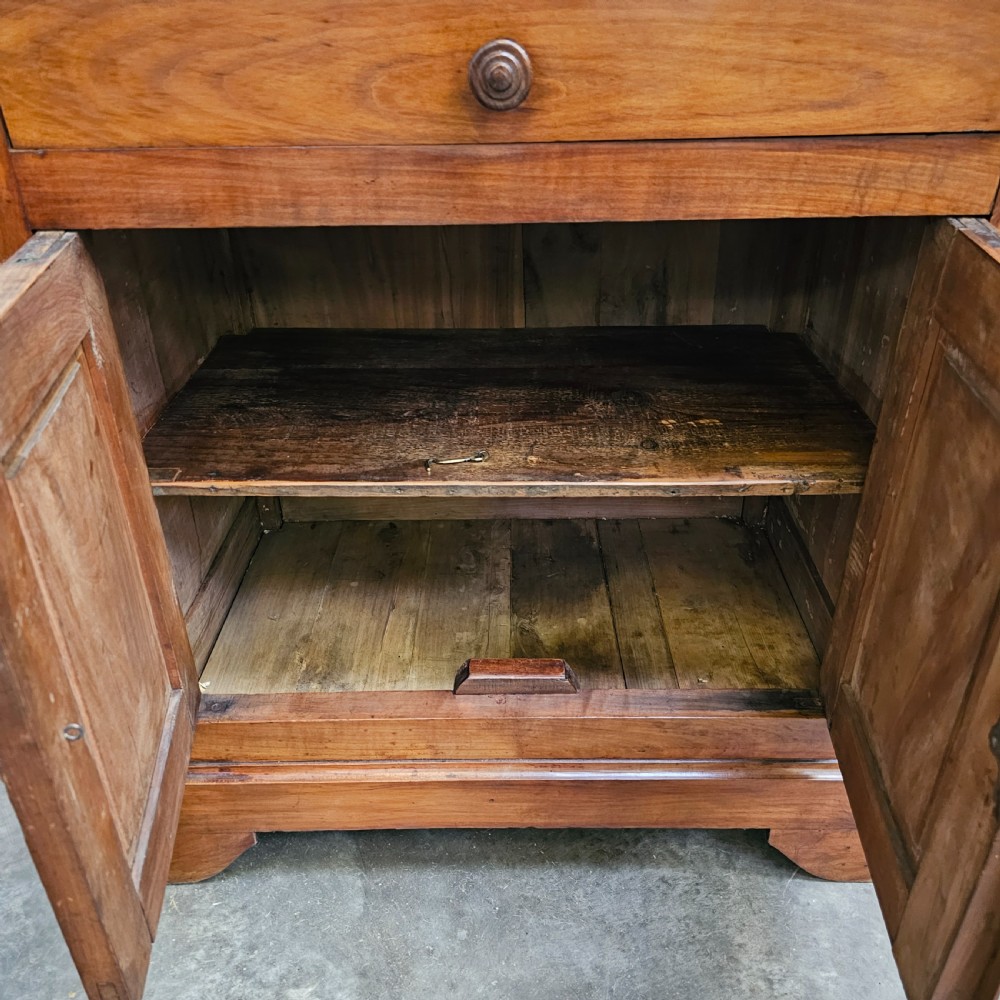 A 19th-century French provincial cherry wood buffet with a single full-width drawer above a two-door cabinet with turned wooden knobs. View VI
