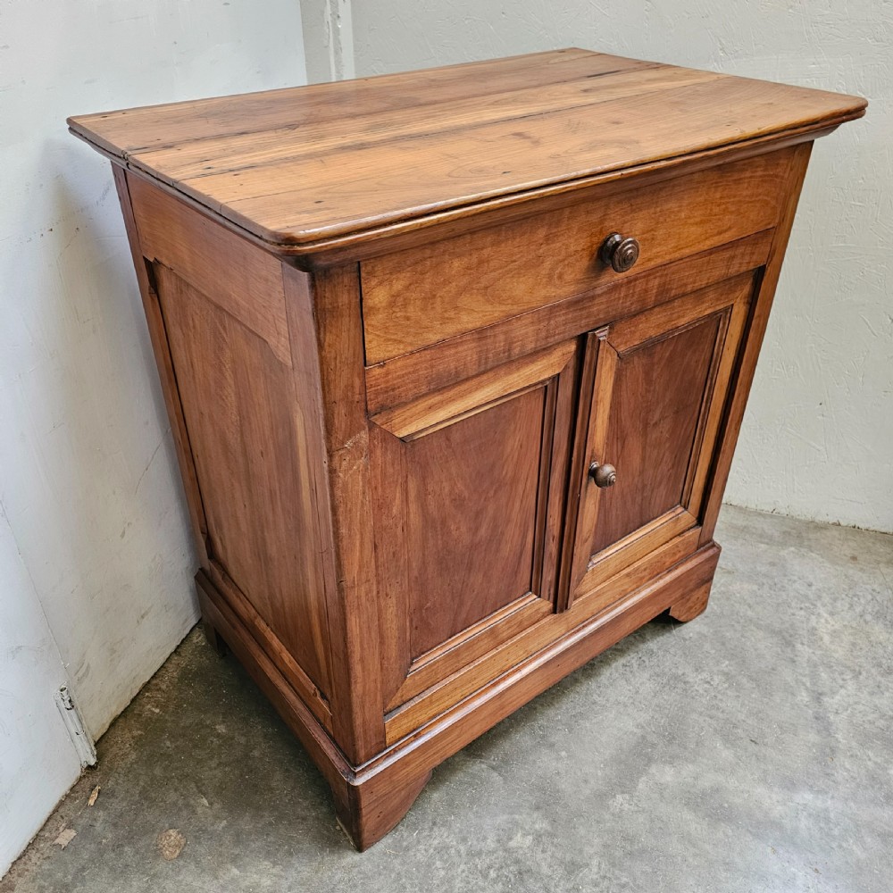 A 19th-century French provincial cherry wood buffet with a single full-width drawer above a two-door cabinet with turned wooden knobs. View III