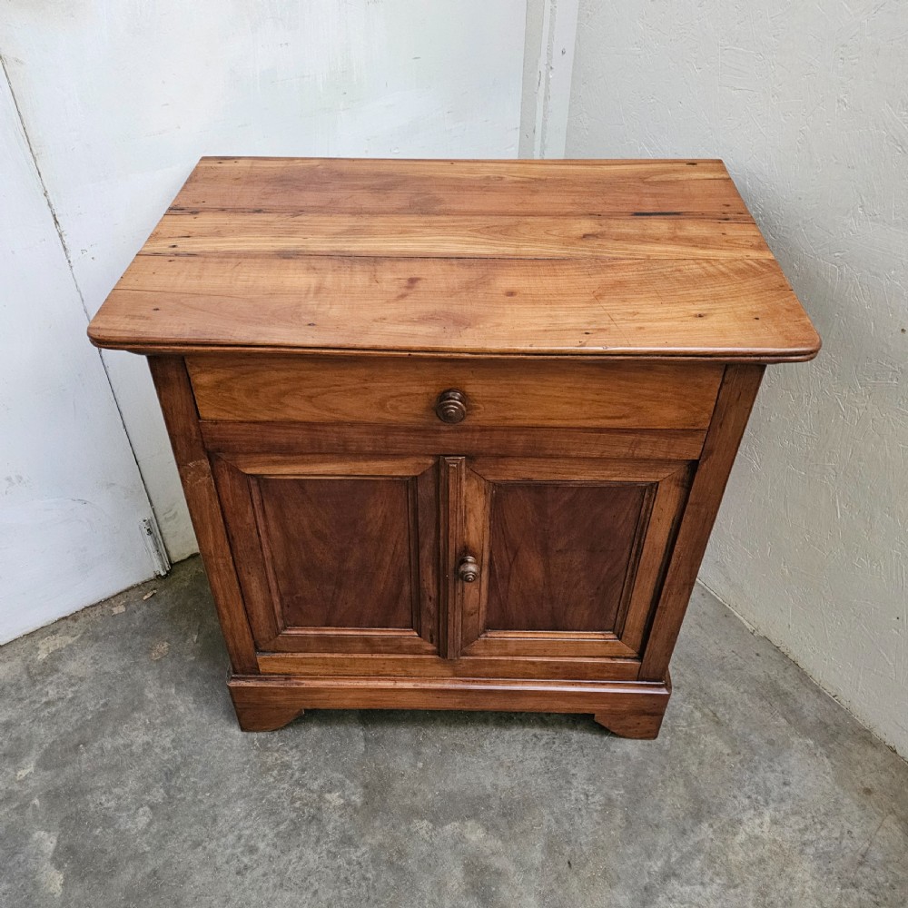 A 19th-century French provincial cherry wood buffet with a single full-width drawer above a two-door cabinet with turned wooden knobs. View IV