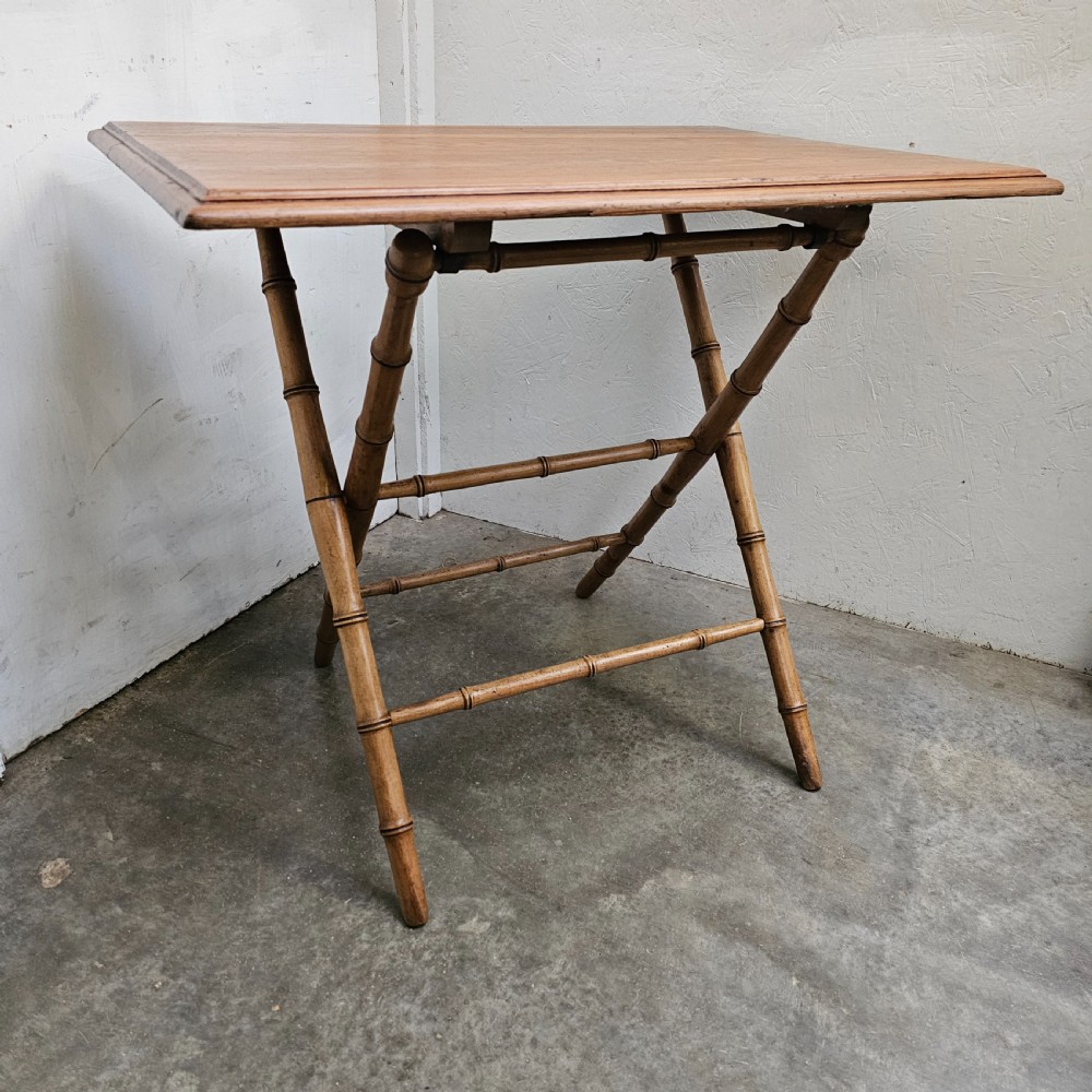 A French folding side table featuring turned wood legs shaped to resemble bamboo stalks and a smooth rectangular top. View II