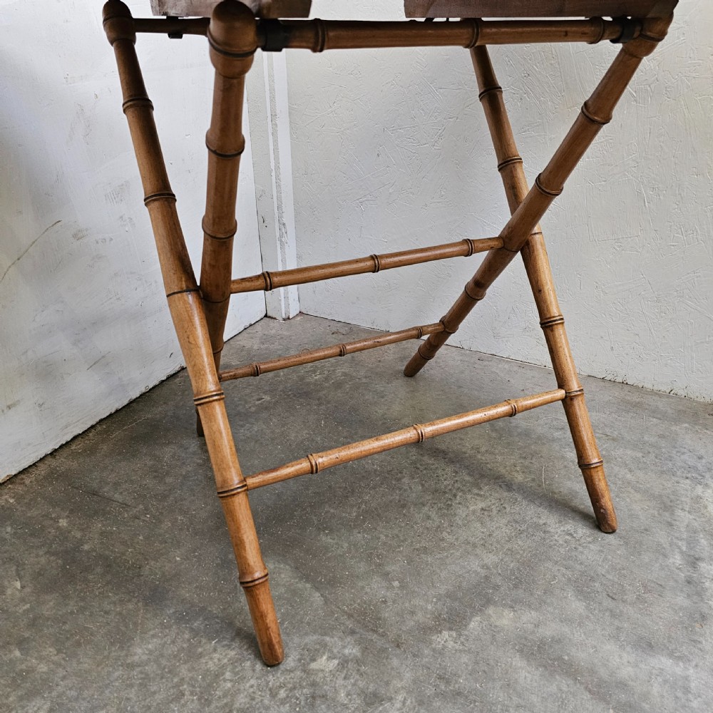 A French folding side table featuring turned wood legs shaped to resemble bamboo stalks and a smooth rectangular top. View III