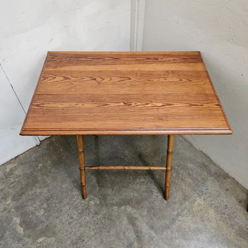 A French folding side table featuring turned wood legs shaped to resemble bamboo stalks and a smooth rectangular top. View V