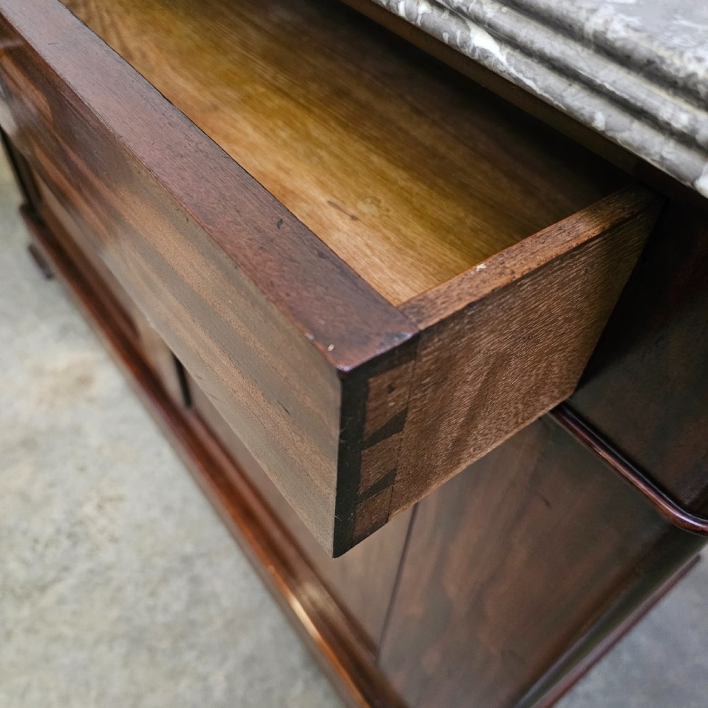 A French Louis Philippe style mahogany buffet with a grey veined marble top, two upper drawers, and two panelled cabinet doors. View III