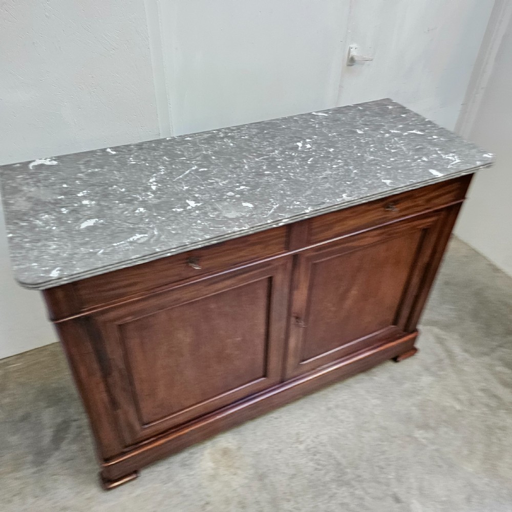 A French Louis Philippe style mahogany buffet with a grey veined marble top, two upper drawers, and two panelled cabinet doors. View VI