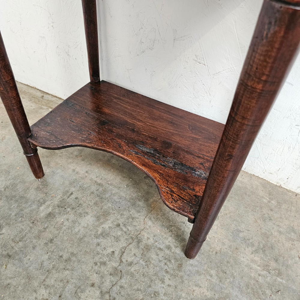 An antique French dark walnut bedside chest featuring an inset white marble top, three stacked drawers with metal rosette knobs, turned legs, and a lower undertier shelf. View III