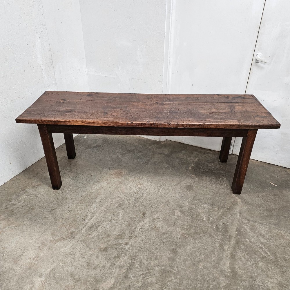 A long antique dark oak tavern table featuring a thick planked timber top supported by sturdy square legs. View III