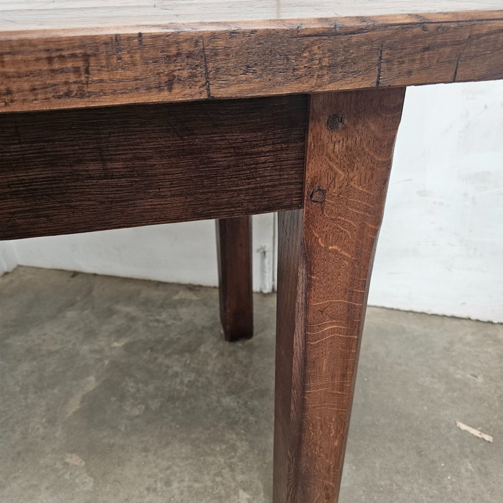 A long antique dark oak tavern table featuring a thick planked timber top supported by sturdy square legs. View VIII