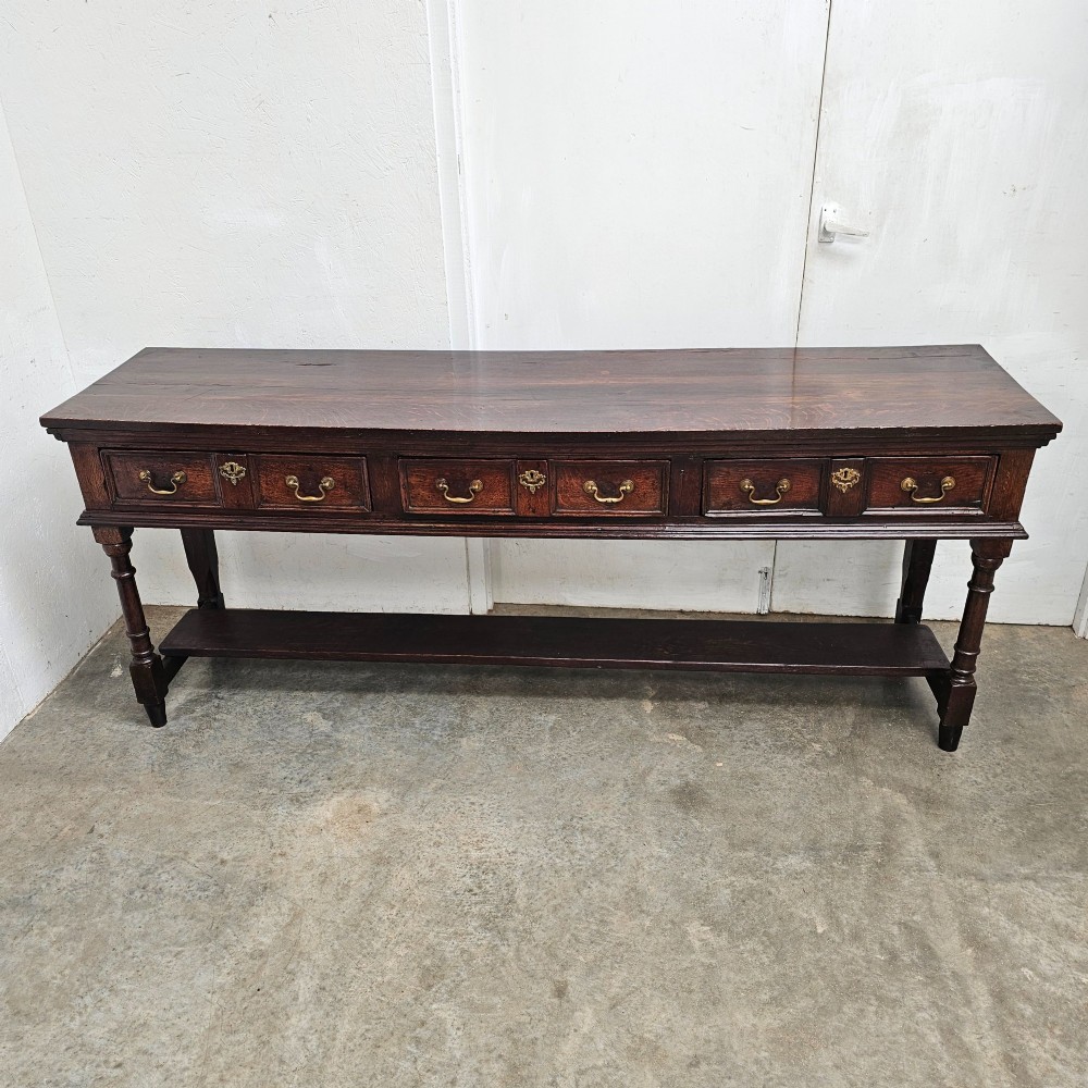 English Oak Three Drawer Sideboard With Potshelf View III