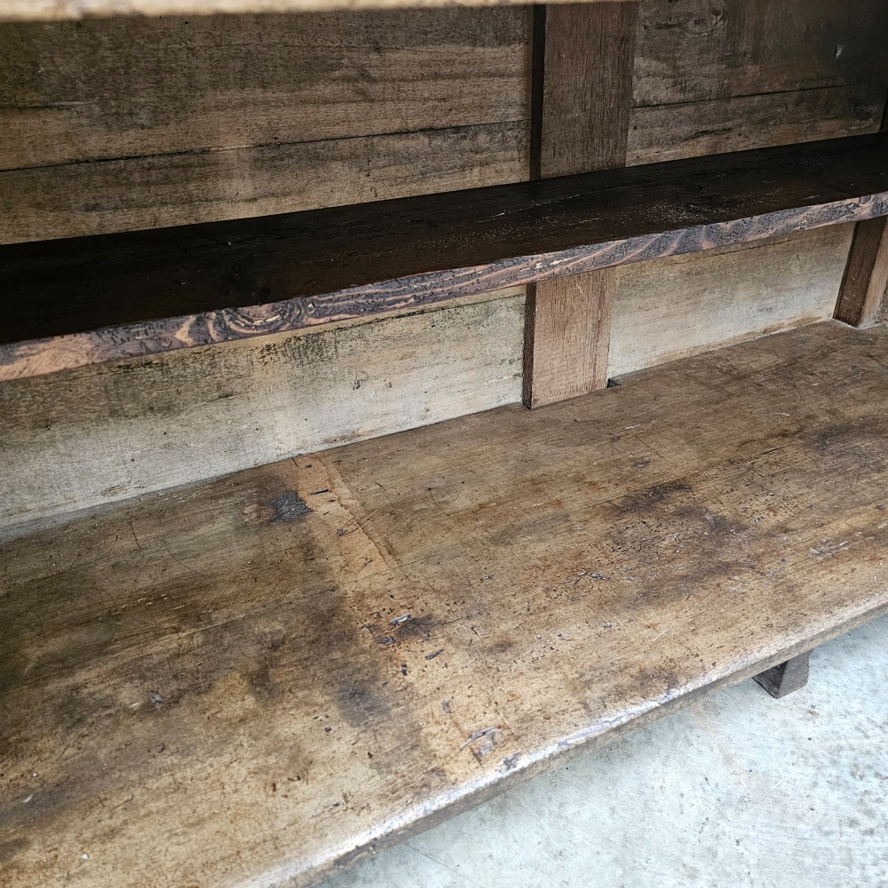 A large rectangular timber shop counter featuring a distressed yellow painted frame with a moulded front panel and a natural wood top. View IV