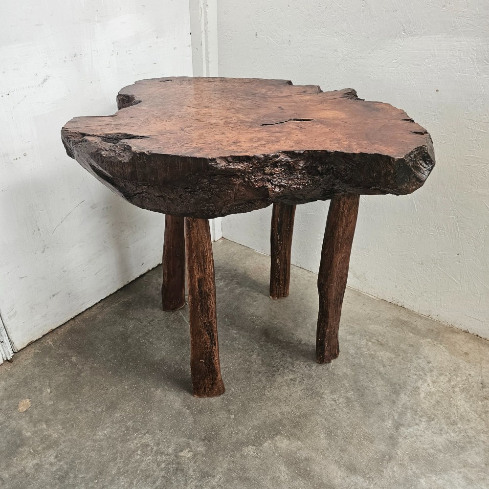 A primitive side table featuring a thick burr thuya timber slab top with natural live edges, supported by four simple wooden legs. View VI