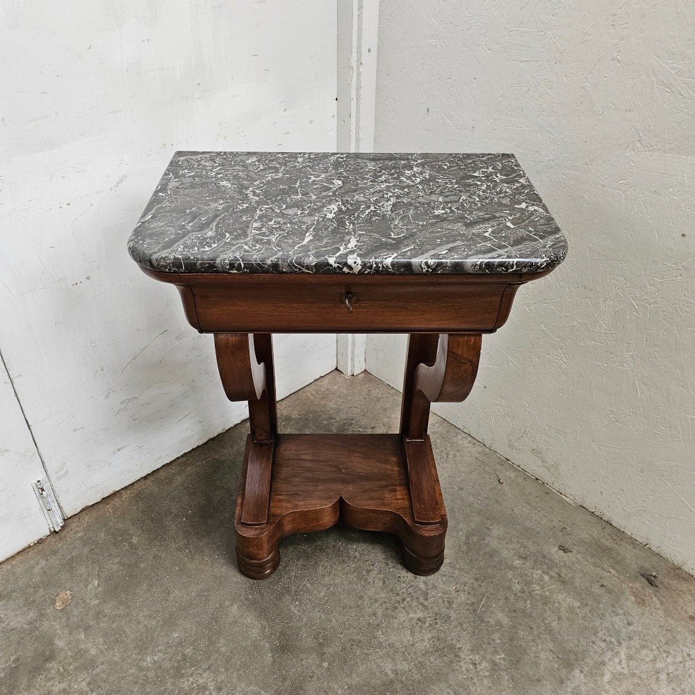 A French walnut console table featuring a grey veined marble top, a single frieze drawer, shaped upright supports, and a shaped plinth base. View III