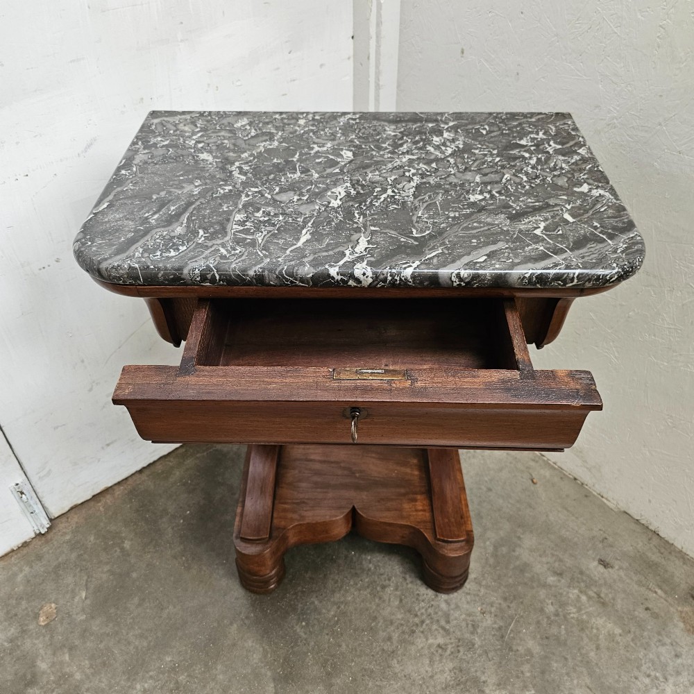 A French walnut console table featuring a grey veined marble top, a single frieze drawer, shaped upright supports, and a shaped plinth base. View IV