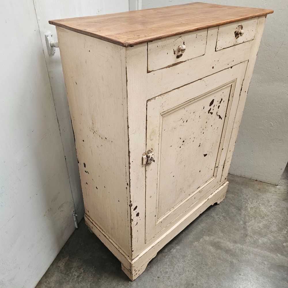 A small painted pine French confiturier cupboard with two upper drawers, a single panelled door, an off-white distressed paint finish, and a natural timber top surface. View III