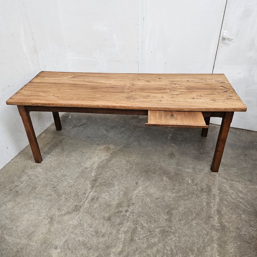 A French rustic elm farmhouse dining table featuring a two-plank top, a pull-out side slide, and square tapered legs. View V