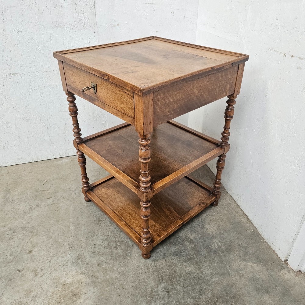 A French walnut etagere featuring three tiers, turned spindle supports, and a single top drawer with a brass handle. View II