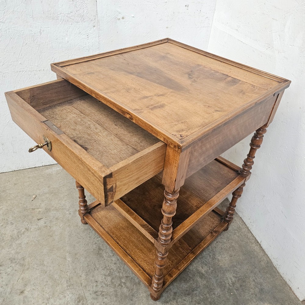 A French walnut etagere featuring three tiers, turned spindle supports, and a single top drawer with a brass handle. View IV