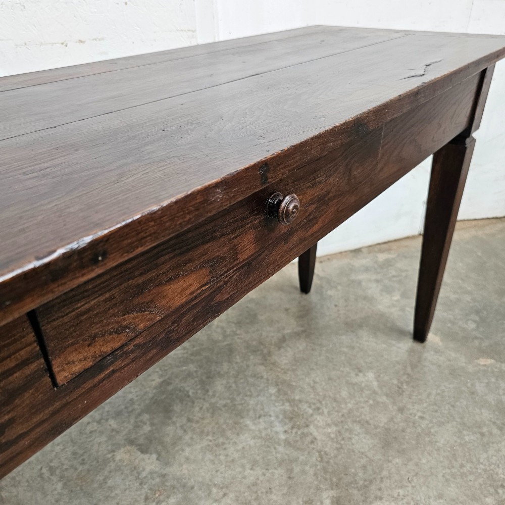 A rectangular dark oak console table featuring four square tapered legs, a single central drawer with a wooden knob, and a flat timber top. View V