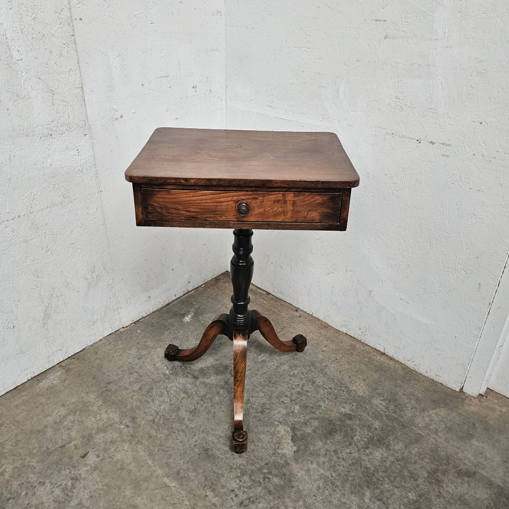 An antique elm pedestal side table featuring a single drawer with a round wooden knob, a turned central stem, and three curved tripod legs. View III